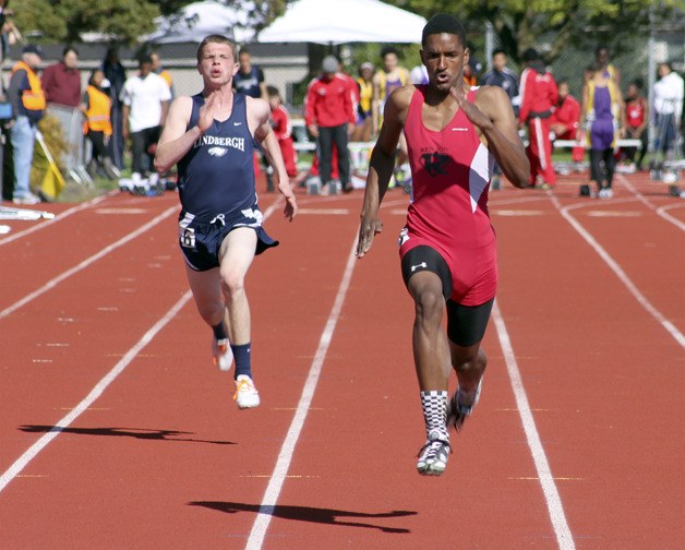 Renton's Immanuel Carter outruns the field in the 100-meter dash April 26 for one of his three wins at the meet.