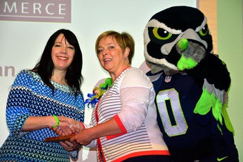 Benson Hill Elementary teacher Varerie Muirhead-Tiscareno accepts her award from Pam Teal