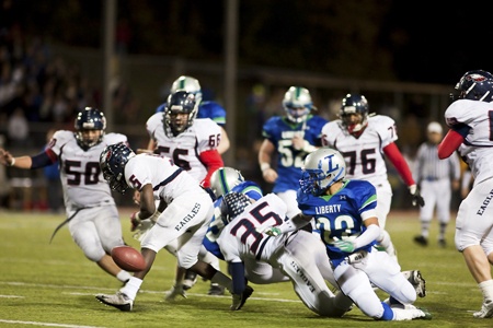 Several Lindbergh and Liberty players scramble after a fumble in the first overtime Friday night.