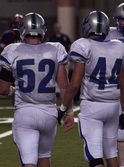 Alex Kaser (52) and Cameron Talley (44) stand on the field at the Tacoma Dome in a semifinal game against Lakes Nov. 27.