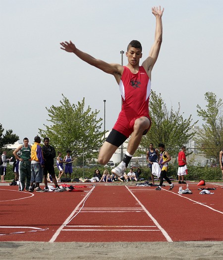 Renton's P.J. Benedictus leaps on a long jump attempt Wednesday during the first day of the Seamount League meet.