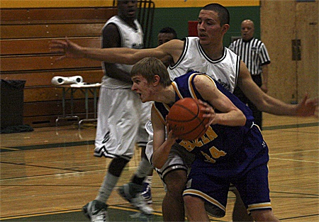 Hazen's Brandt Graybeal works inside against an Evergreen defender.