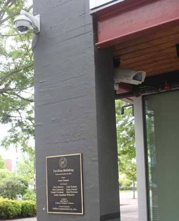 Video cameras peek out from behind a pillar at the Renton Transit center.