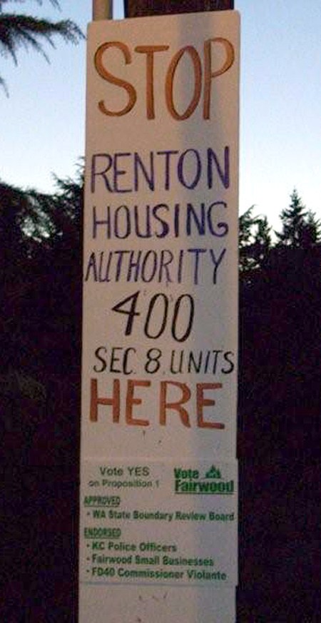 A sign posted near 140th Avenue Southeast and Petrovitsky Road warned that the Renton Housing Authority is planning to build 400 low-income housing units in Fairwood. The agency has no such plans