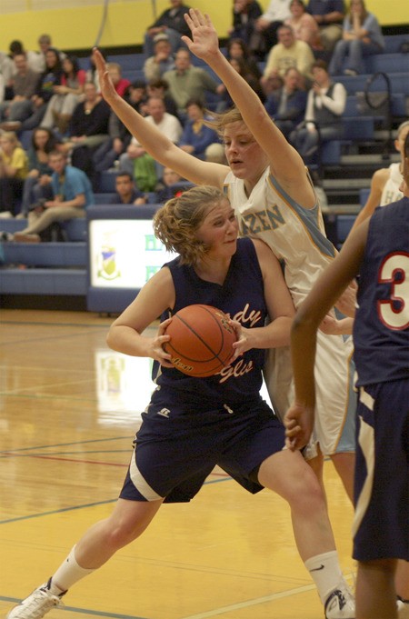 Lindbergh's Emily Graver is defended by Hazen's Michelle Wnek Dec. 8.