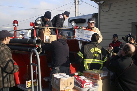 Renton firefighters unload about 1