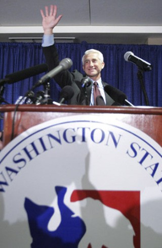 U.S. Congressman Dave Reichert waves to the crowd after giving a speech Tuesday night at a Republican Party election night party at the Hyatt Regency hotel in Bellevue.