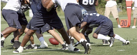 Running back Devin Moore dives for a loose ball. The Seahawks signed Moore to the team's practice squad.