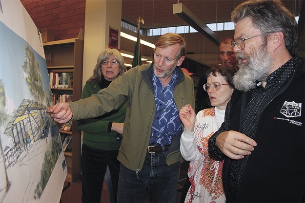 Renton residents get their first look at exterior drawings of the proposed new downtown library during an Open House March 26.