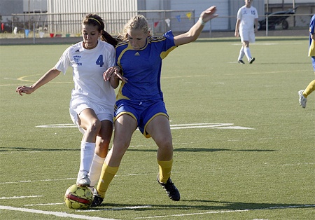 Hazen's Erin Anderson tries to knock the ball away from a Mount Rainier player. Anderson was the Women of the Match in the Highlanders' 6-2 loss Sept. 24.