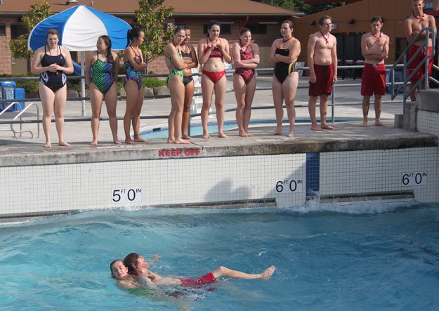 Lifeguards wait for their opportunity to perform a practice drill Tuesday at Henry Moses Aquatic Center. Approximately 85 lifeguards received training this week in preparation for the opening of the city’s beaches and pools.