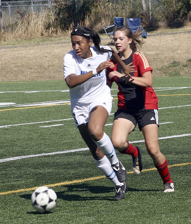 Hazen junior defender Tyra Markey clears the ball at a jamboree at Hazen High School Saturday.