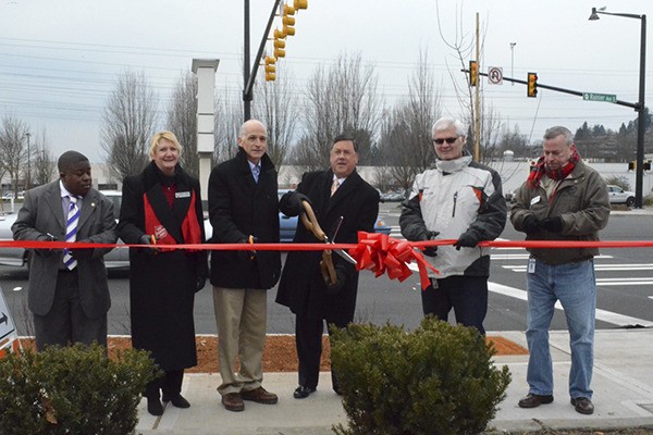 Participating in the ribbon cutting Monday morning of the completed Rainier Avenue improvements were