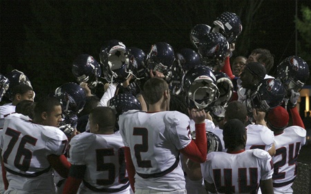 The Lindbergh football team celebrates after a 31-2 win over Evergreen Oct. 30. The win completed a perfect league record and Seamount championship for the Eagles.