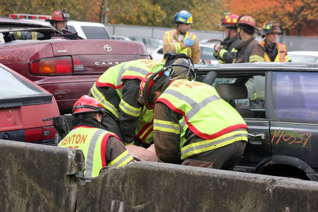 Renton firefighters work to extricate a victim during a recent training exercise. If approved by voters