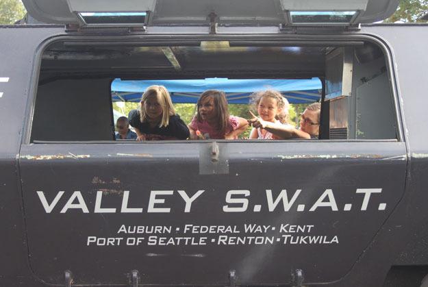 Children check out a Valley SWAT vehicle during National Night Out Aug.4 at Thomas Teasdale Park.