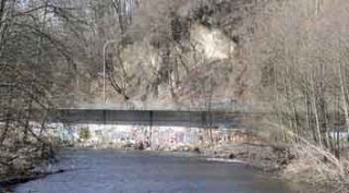 Graffiti is shown on the bridge carrying SR 169 next to the Cedar River in this photograph shot earlier this spring. Two men were arrested recently by Renton Police for spray-painted the bridge.