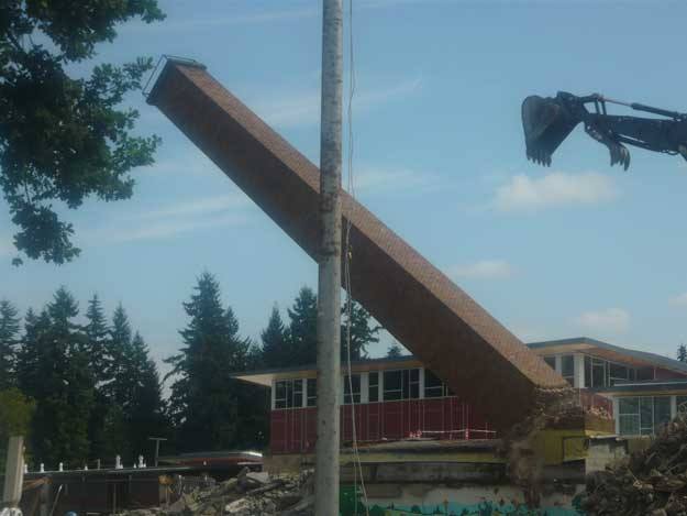 The old smokestack at Hillcrest Elementary falls during demolition this past month.