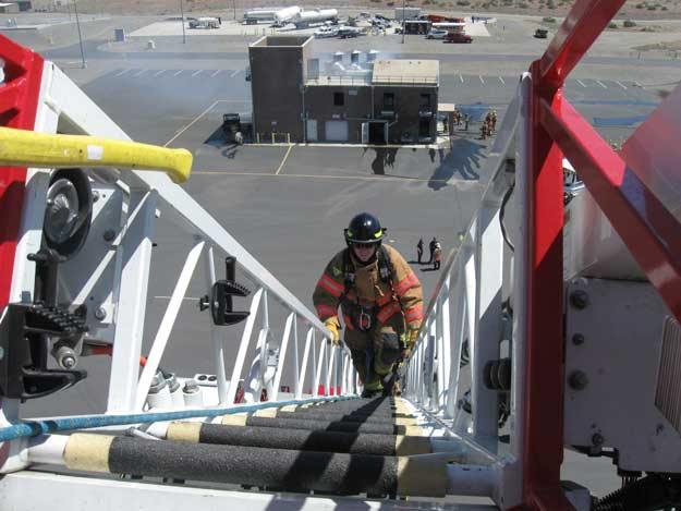 Climbing the 105-foot ladder.