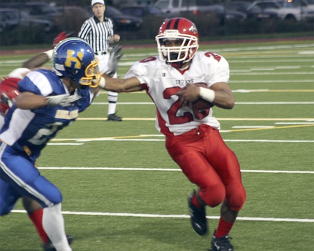 Renton's Mar'que Fluker brushes off a defender against Hazen.