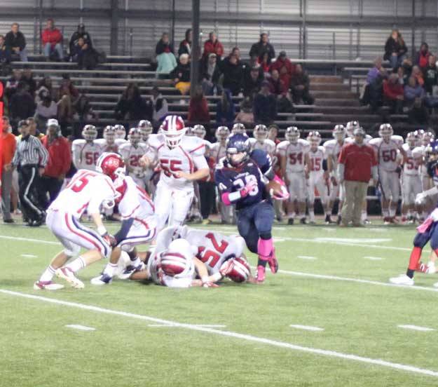 Daniel Wiitanen runs past the Kennedy defenders. Wiitanen had four touchdowns in the game.