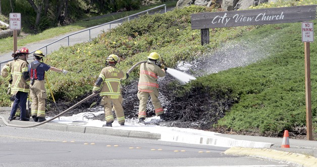 A fire in the landscaping below the City View Church on Southwest Sunset Boulevard sent a plume of smoke over downtown Renton near Fred Meyer at about 2:30 p.m. Tuesday. The fire was started by what fire officials describe as a modified fireworks device; fireworks are illegal in the city. Investigators talked with witnesses who saw two  juveniles running from the area before the fire.