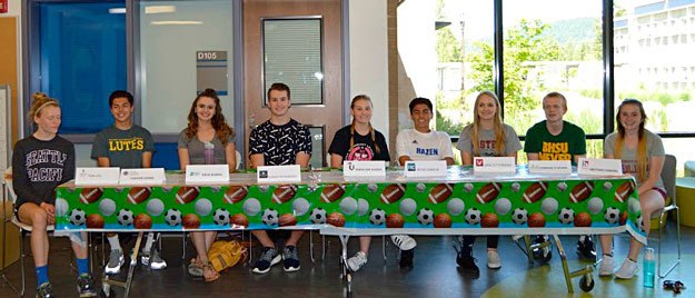 Hazen senior athletes sign their letters of intent.