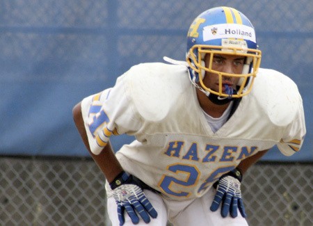 Hazen running back James Holland waits for a handoff in practice.