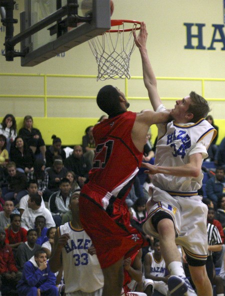 Hazen's Brandt Graybeal goes up for a shot against Renton.