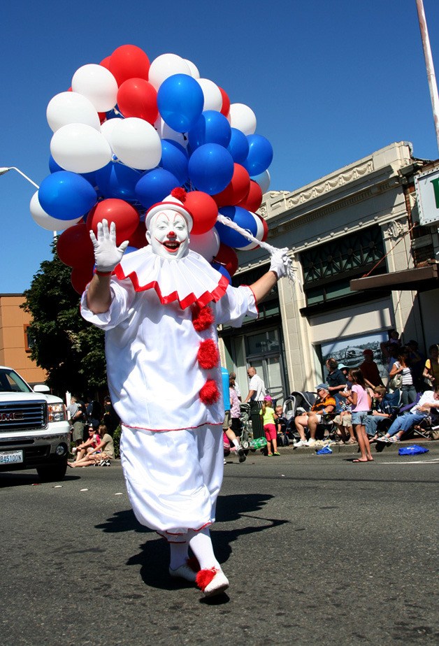 A clown marches in the 2010 River Days parade along South Third Street in Renton.