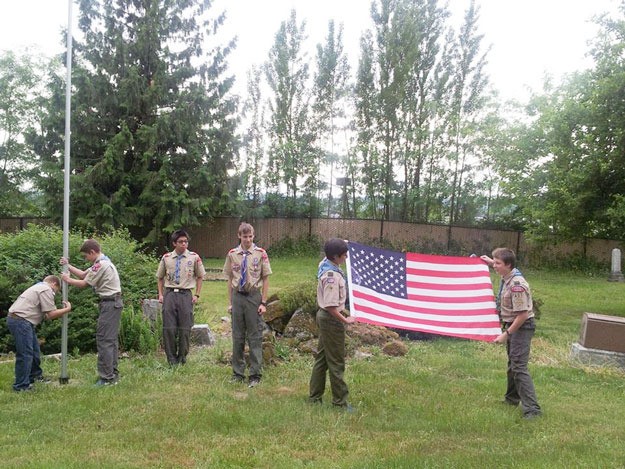 Boy Scouts around the area were up early on Monday to hang flags for Memorial Day.