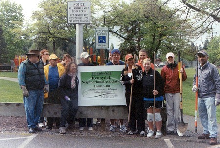 A group of volunteers from the Kennydale Neighborhood Association and the Kennydale Lions Club spread bark at the Kennydale Lions Park for Earth Day April 24.