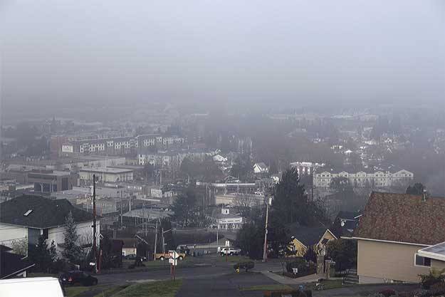 A blanket of fog hangs over downtown Renton in this photo taken Tuesday from Renton Hill.