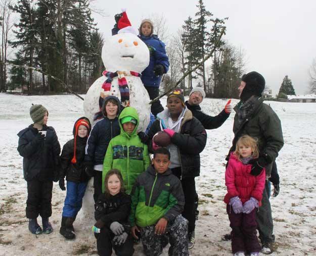 Revelers at Teasdale Park built an eight-foot snowman during their day off.