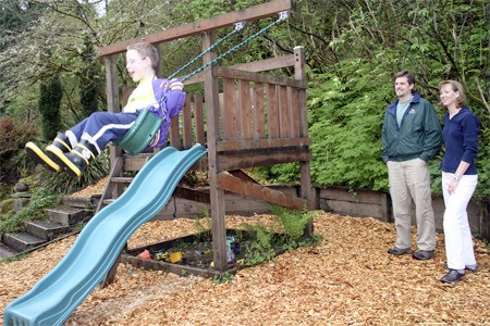 Luke Douglass swings high in his backyard just off the Maple Valley Highway