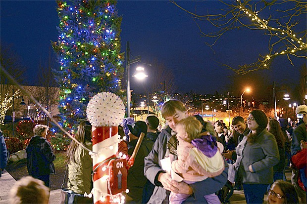 Renton City Councilman Randy Corman threw the switch for the annual city Christmas Tree Lighting ceremony on Saturday.