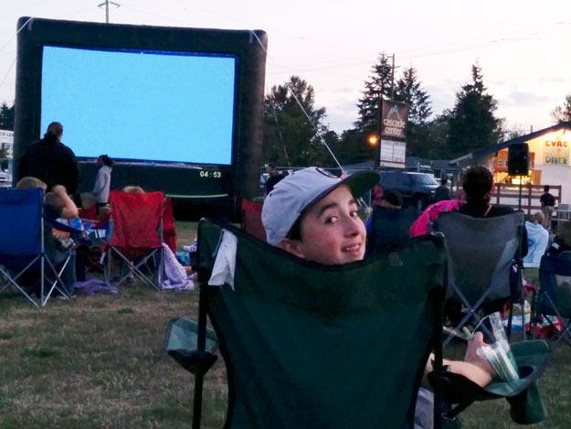 Michael Bray gets ready to watch “Cloudy With a Chance of Meatballs Part 2” Aug. 22 at the Cascade Vista Athletic Club field.