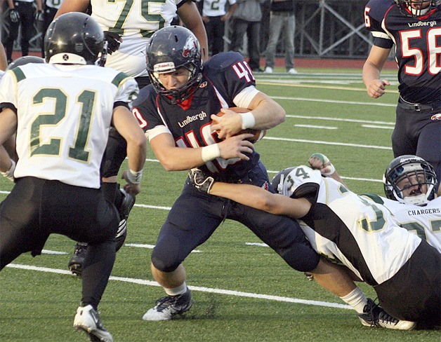 Lindbergh running back Daniel Wiitanen plows through Marysville Getchell defenders.