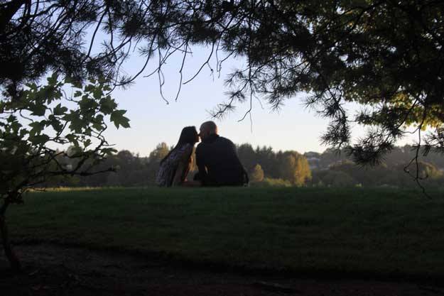 An unidentified couple share a moment just before sunset recently at Cedar River Trail Park.