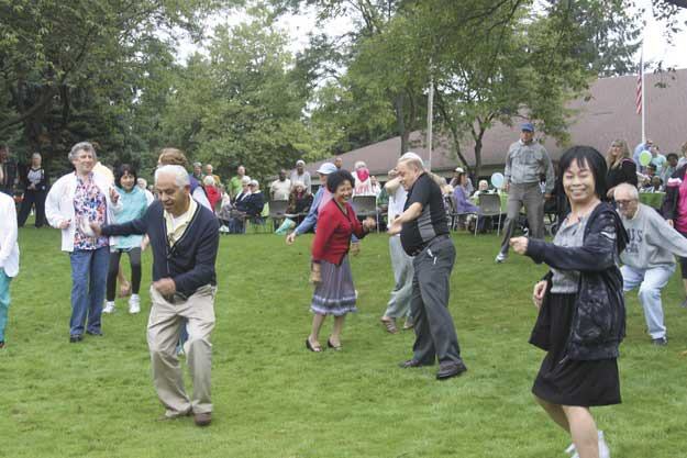 Seniors compete in a dance competition during the Renton Senior Activity Center's 'Rocking on the River' event