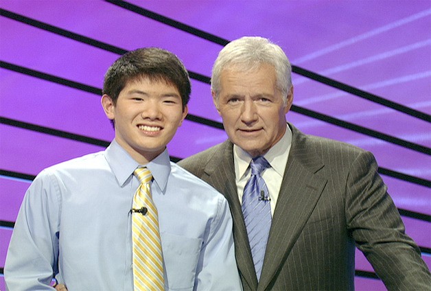 Kentridge’s Christian Ie stands with Jeopardy host Alex Trebek.