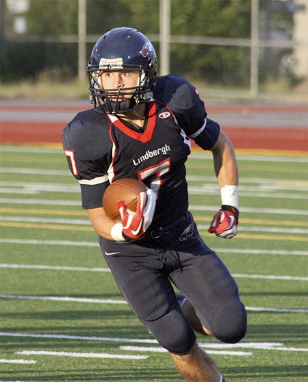 Lindbergh's Cam Callen rounds the corner on a rush against Marysville Getchell.