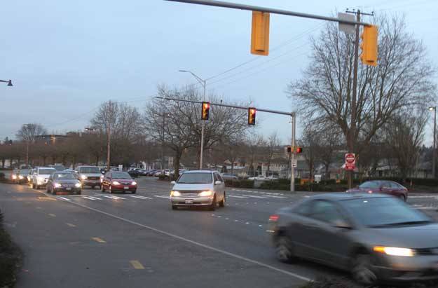 Commuters traverse the intersection of Logan Avenue and North Fourth Street Tuesday night. This four-block section of Logan Avenue will be rebuilt this summer to repair damage.