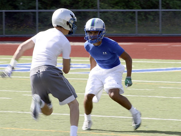 Liberty's Chandler Jenkins locks onto a receiver during practice.