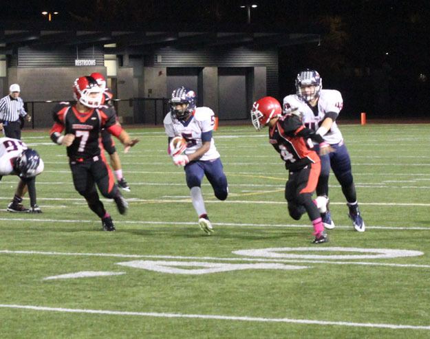 Lindbergh's Deangelo Faust breaks through the Renton defense.