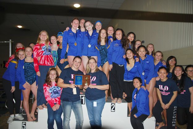 The Hazen girls swim team pose for a photo following their Seamount League victory.