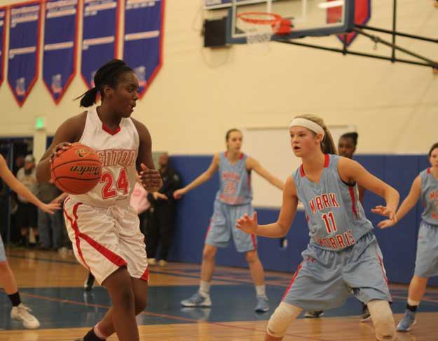 Renton's Natajia McMillan drives the ball toward the net as Mark Morris's Ashley Coons defends during Friday's game at Kent-Meridan High School.