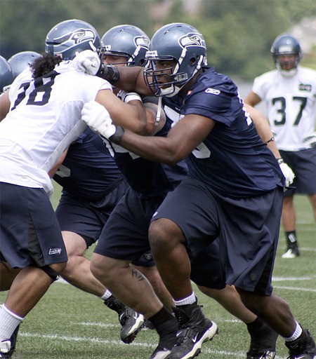 Seattle's Russell Okung works in offseason workouts in June.