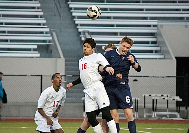 Lindbergh and Renton players battle for a ball  April 15.