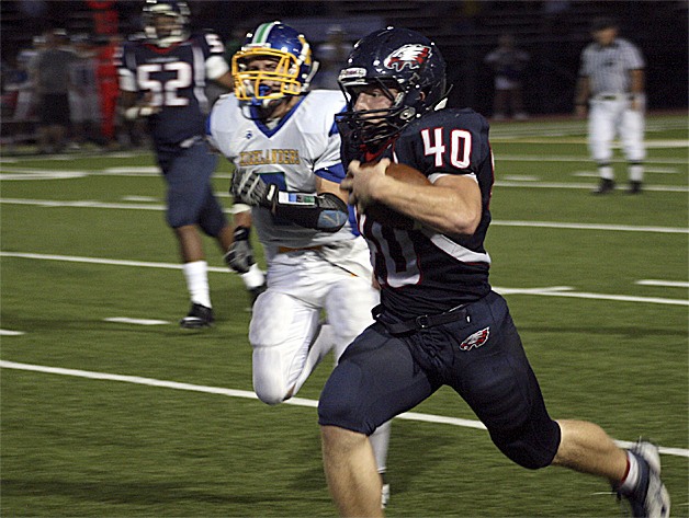 Lindbergh sophomore Daniel Wiitanen runs around Hazen defenders.